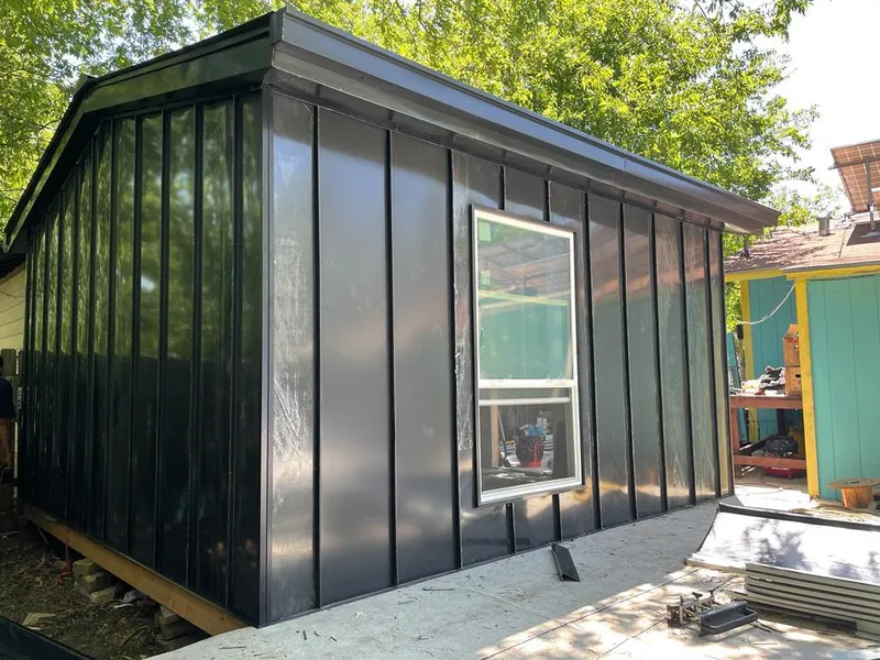 Black standing seam metal wall panels for Roof Inspection in Fletcher